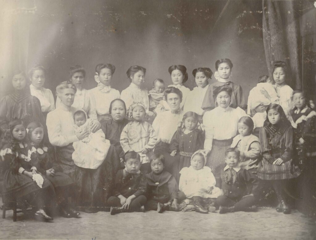 Residents and staff of the Oriental Home and School, [190-?]. Victoria Chung (seated, second from the left) became the first Chinese Canadian certified physician and worked as a medical missionary in China. <br><i>Oriental Home and School fonds, item BCCA 2801.0020</i>
