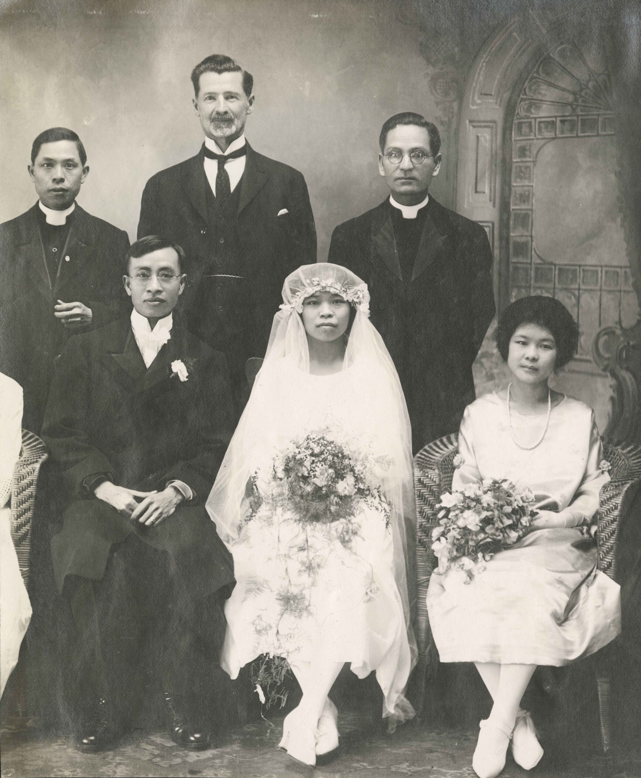 Wedding party of Reverend C.C. Shiu and his bride, “Julia”, 1924. Julia arrived in Canada as an eight-year-old, was admitted to the Oriental Home and School in 1917, baptized in 1920, and discharged on her wedding day. Rev. Shiu had recently arrived from China, and was appointed to the Chinese Methodist Mission in Winnipeg, Manitoba. In the back row (centre) is Dr. S.S. Osterhout, Superintendent of Oriental Missions from 1906 to 1939. <br><i>Oriental Home and School fonds, item BCCA 2801.0120</i>